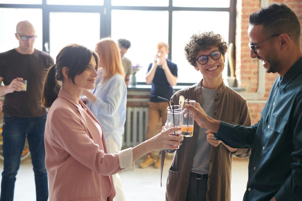 pexels photo 3182824 3182824 Group of diverse office colleagues enjoying drinks and a casual conversation in a bright workspace.